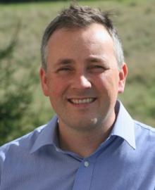 A man wearing a light blue shirt.