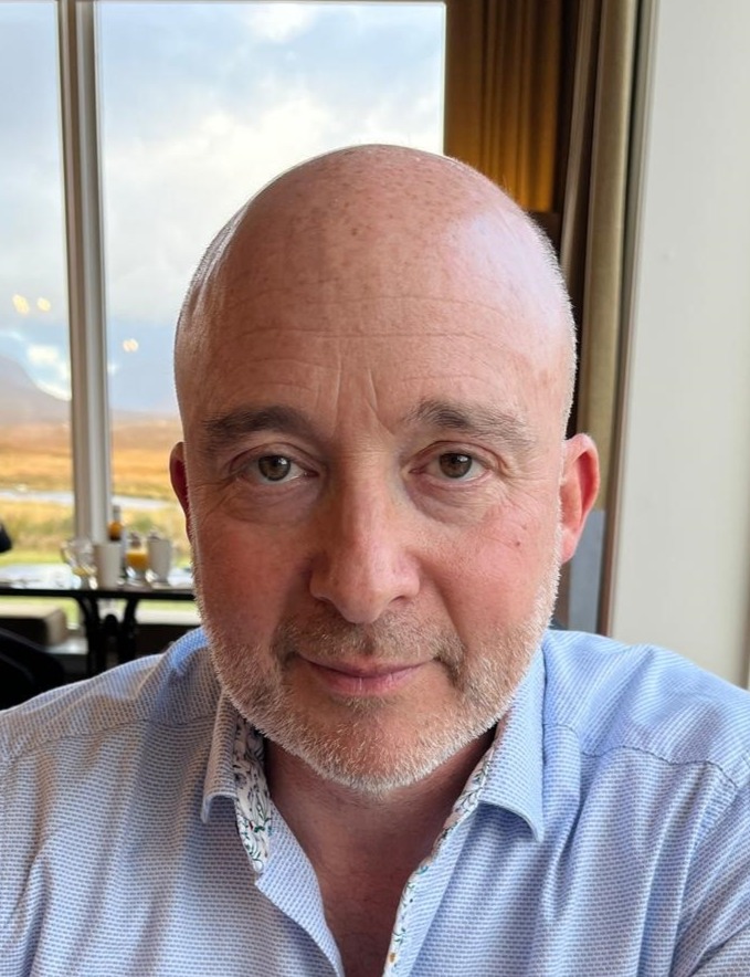 Image of a man wearing a light blue shirt