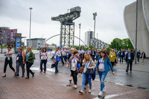 A group of NHS event attendees outside the SEC, Glasgow.