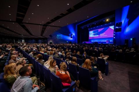 people sitting in an auditorium