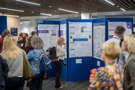 People viewing the 2026 poster displays