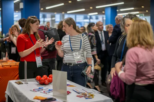 General view of people around the exhibition displays