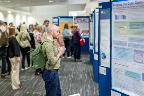 Person looking at poster disaply