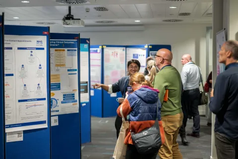 People viewing the 2026 poster displays