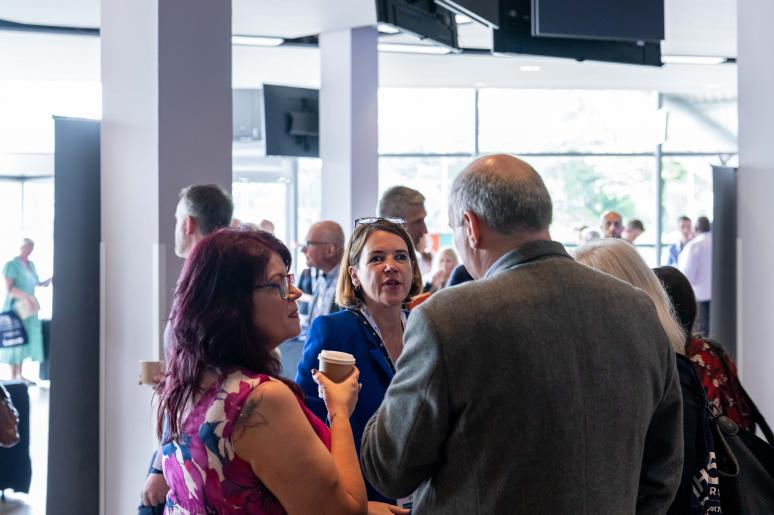 A group of event attendees chatting