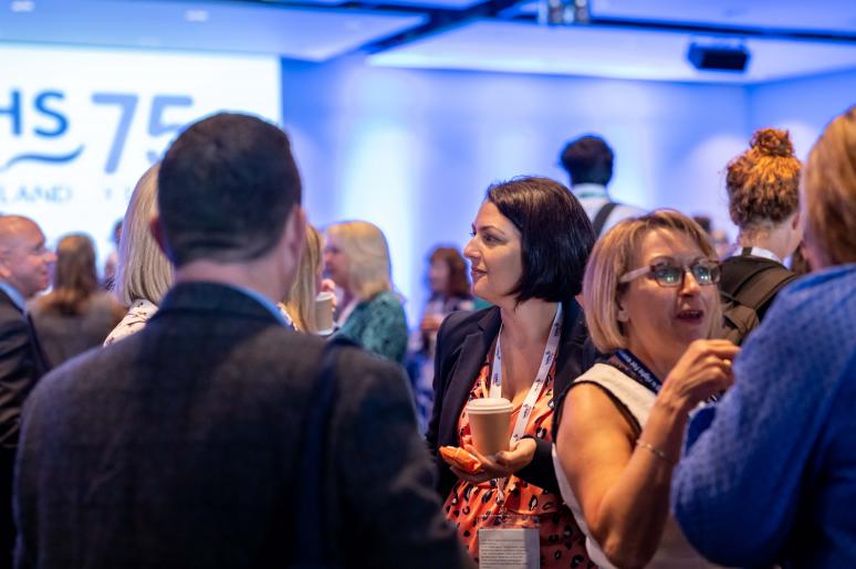 Multiple groups of event attendees chatting