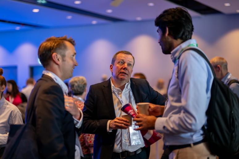 A group of event attendees chatting