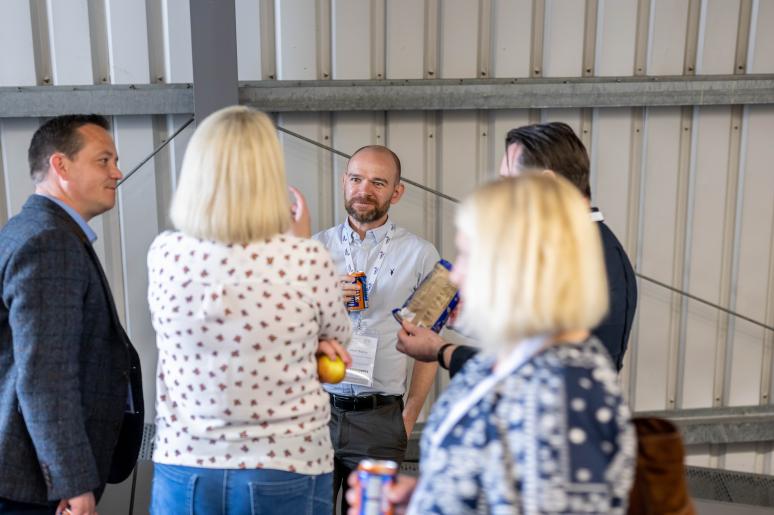 A small group of event attendees chatting