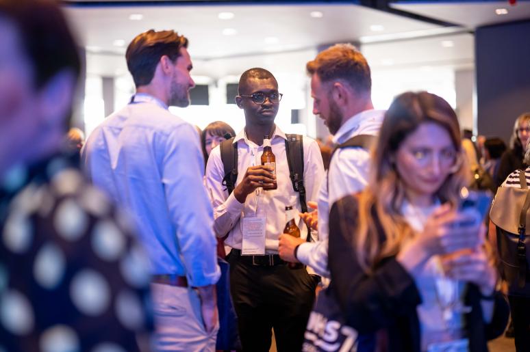A group of event attendees speaking