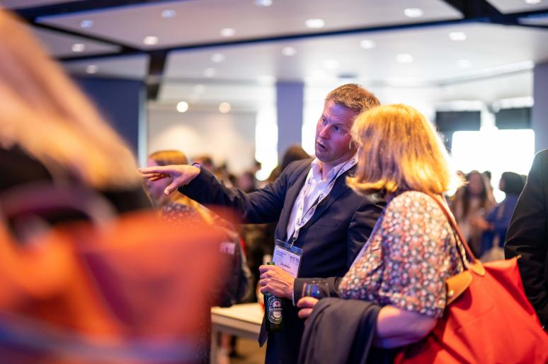 Two event attendees speaking