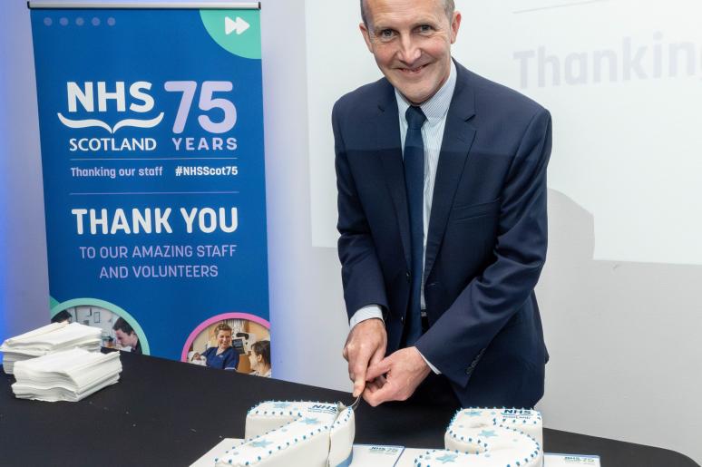 A man cutting the cake