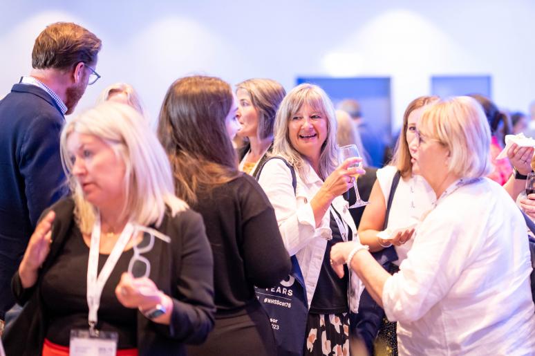 A group of event attendees chatting